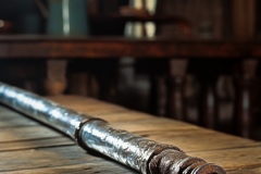spiritusloci_close_up_photo_of_a_single_piece_of_lead_pipe_layi_57bfa52a-ae59-48a0-90c3-7f97cf46d378